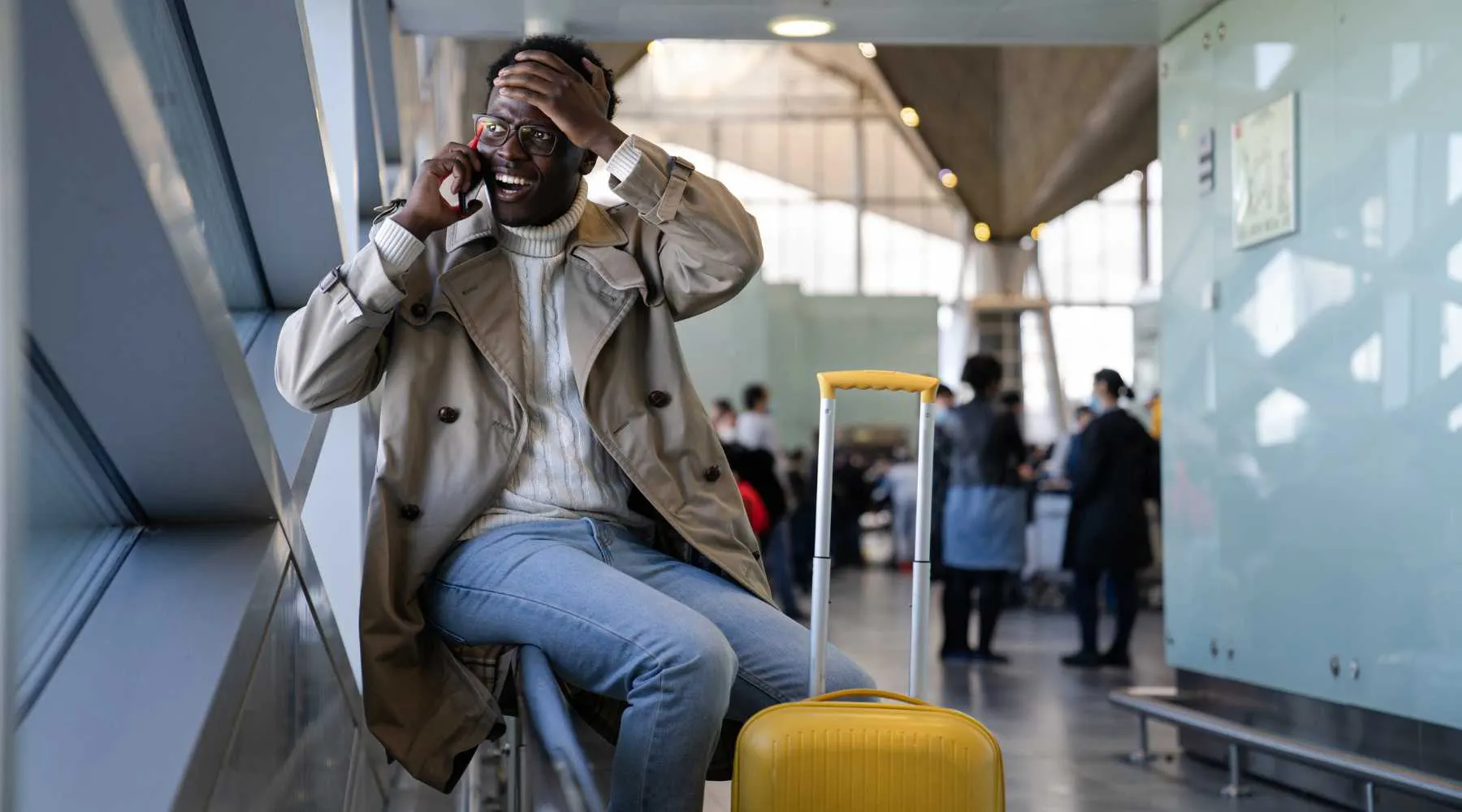 Traveller on their phone at the airport