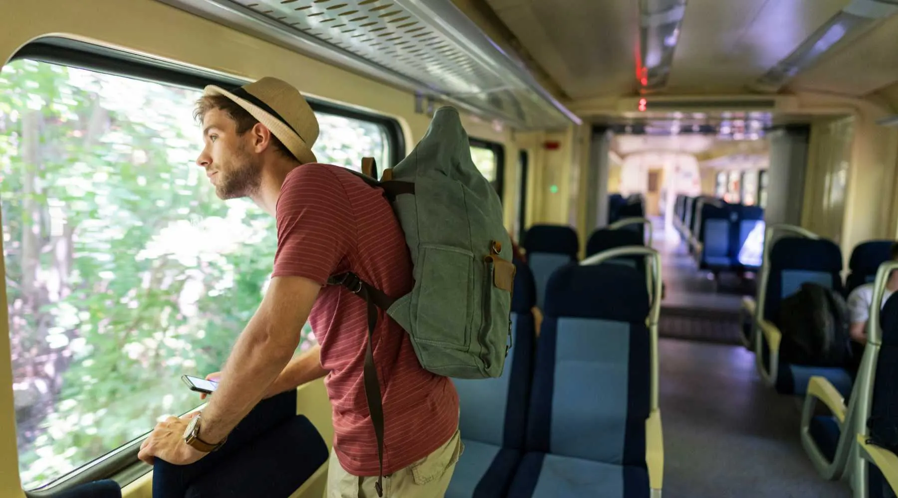 A backpacker on a train trip