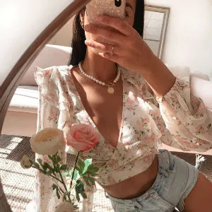 Girl taking selfie in Hello Molly top