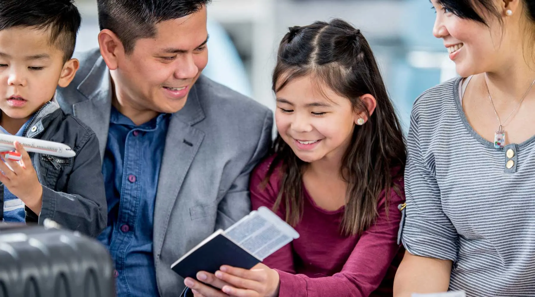 a family with kids on holiday with their passports