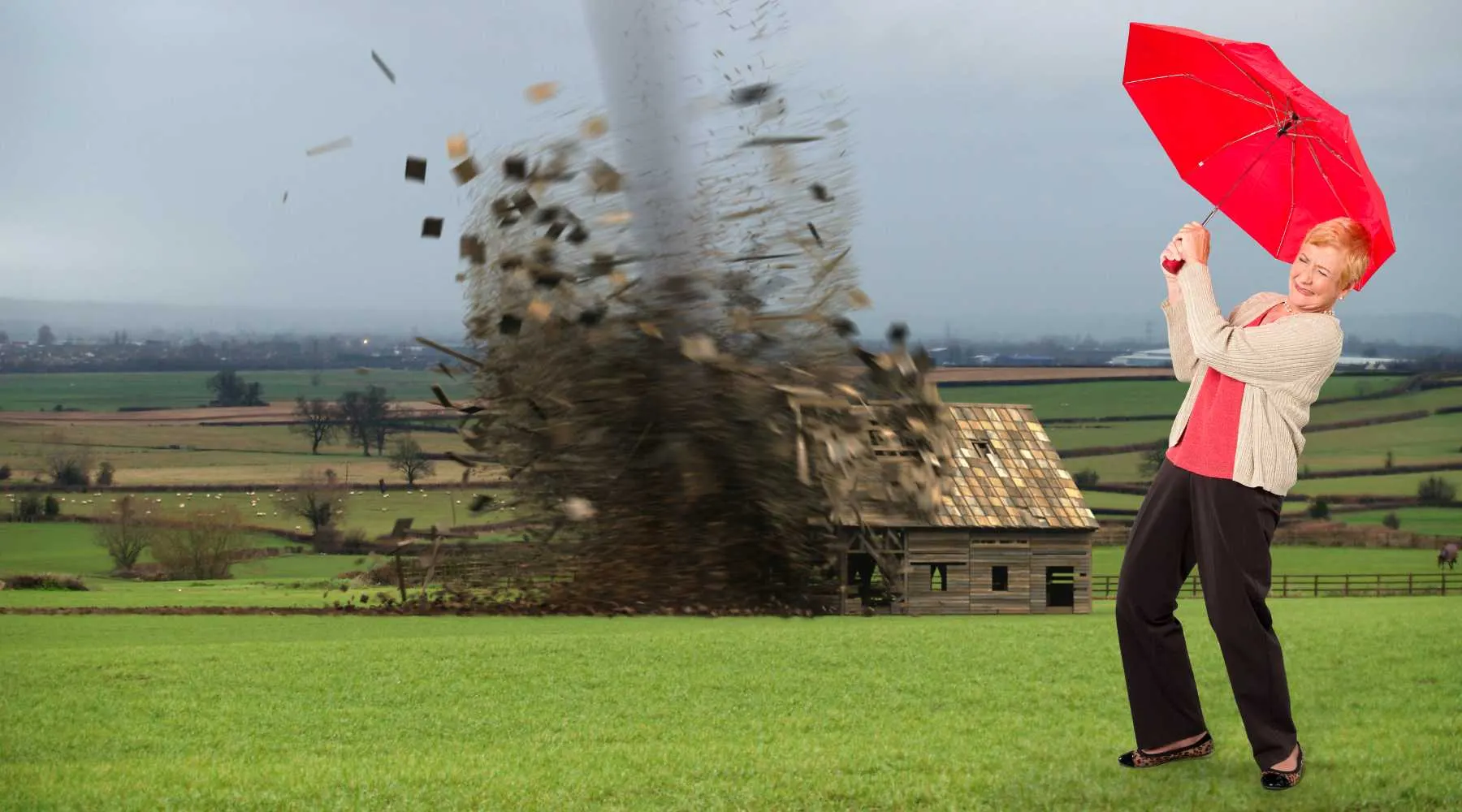 A woman with an umbrella in a storm