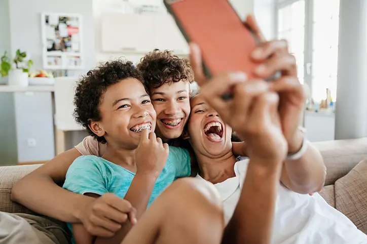 mom with kids taking selfie
