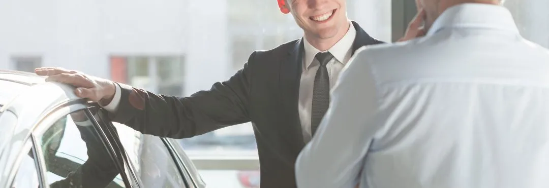 car salesman at dealership
