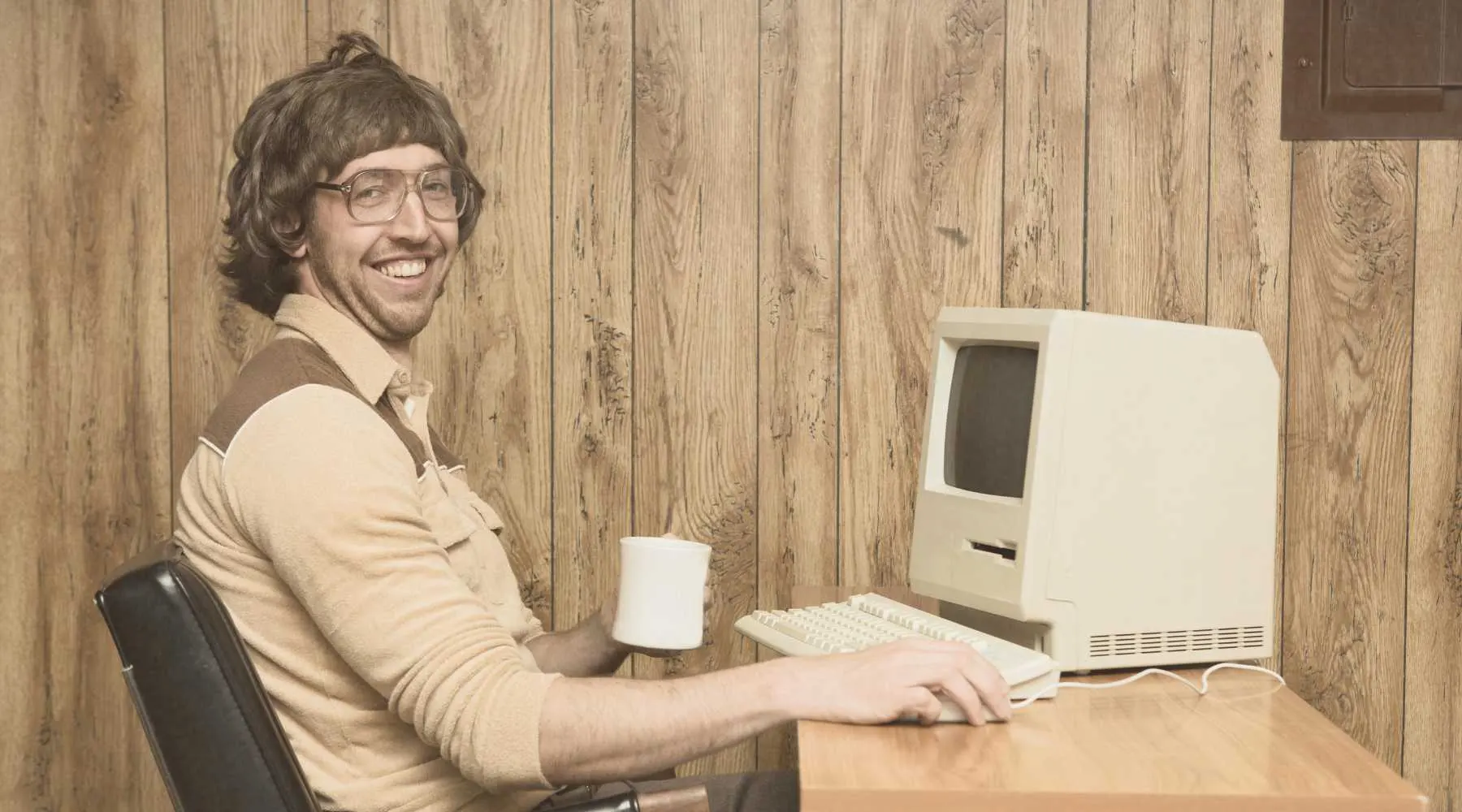 a statistics nerd at a vintage computer