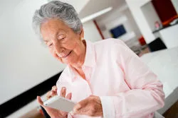 Elderly woman using her mobile phone