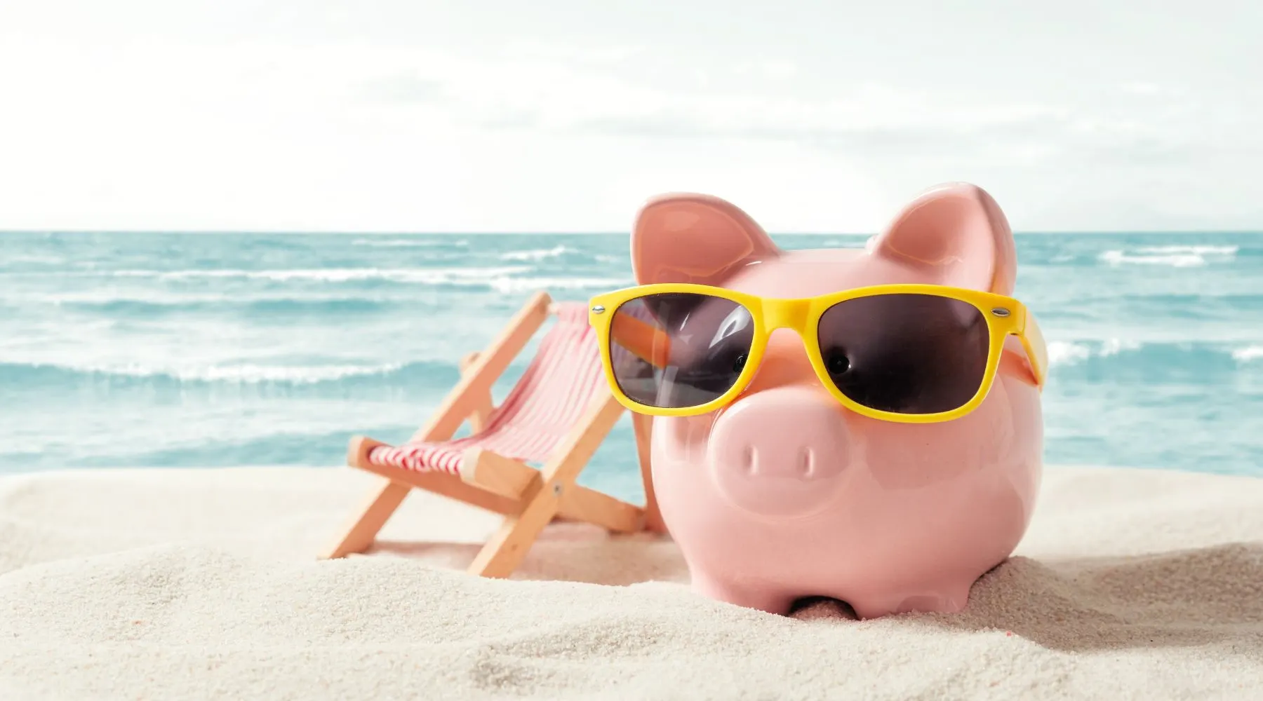 Piggy Bank on Vacation. Finance and Travel Concept