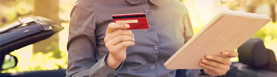woman_holding_tablet_and_creditcard_Shutterstock