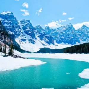 Partially frozen Moraine Lake in winter in Banff National Park, Canada