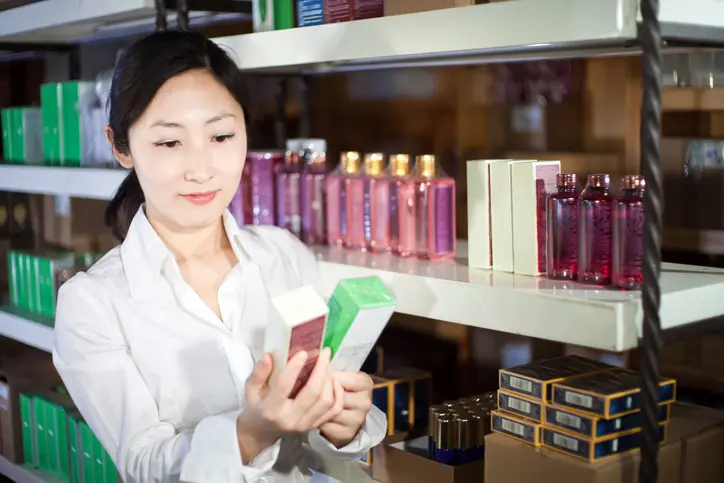 woman buying perfumes