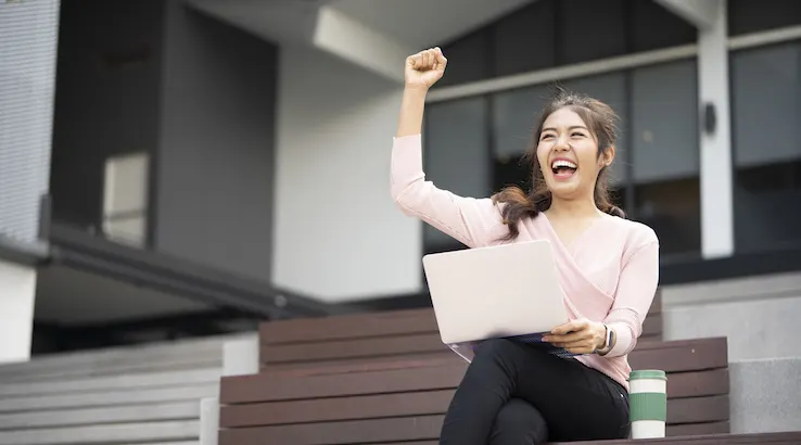 Happy woman with laptop