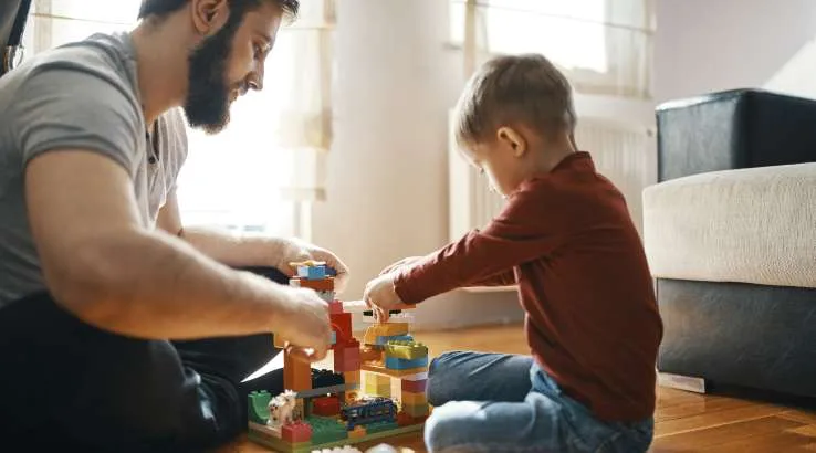 Father and son with building blocks
