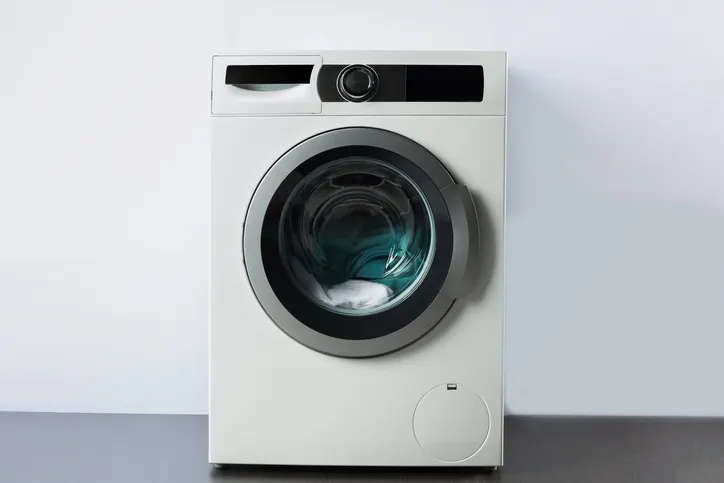 Washing machine against wall