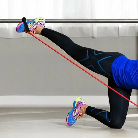 Woman stretching with resistance bands
