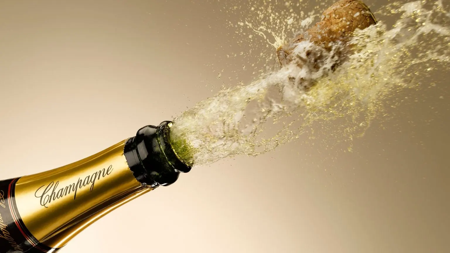 Champagne and cork exploding from bottle