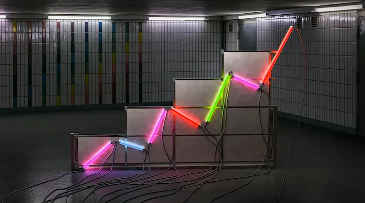 A graph made of neon tubes in a room