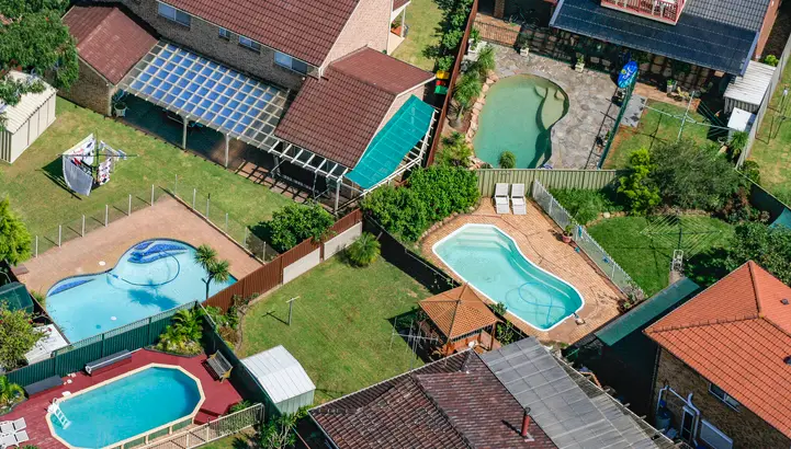 Stereotypical Australian backyards with swimming pools, house, suburb in Sydney, Australia, aerial photography