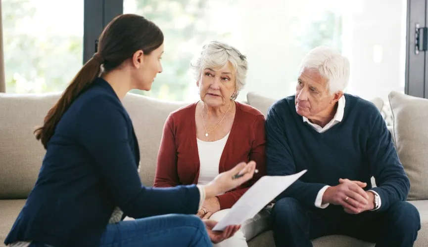 senior couple meeting with a wills and estate lawyer
