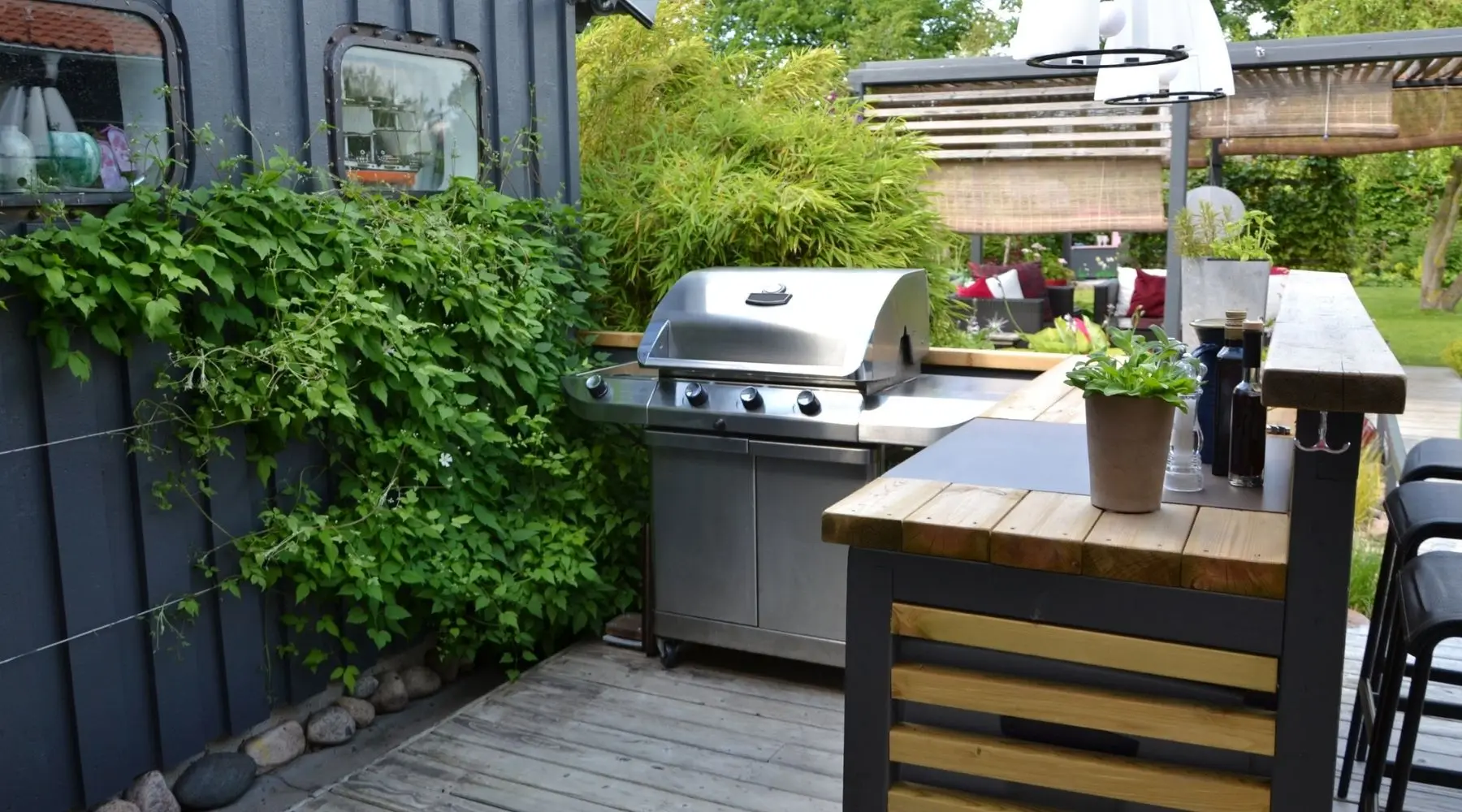 An outdoor kitchen, including a barbeque and countertops