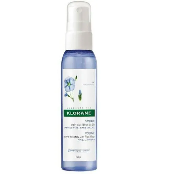 Bottle of Klorane texture spray on white backdrop. 