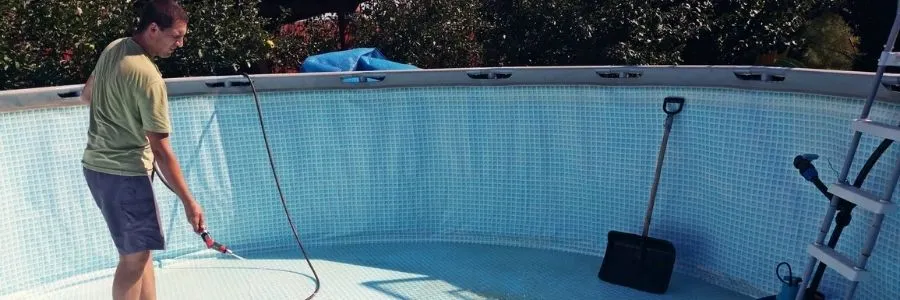 Man Cleaning Pool