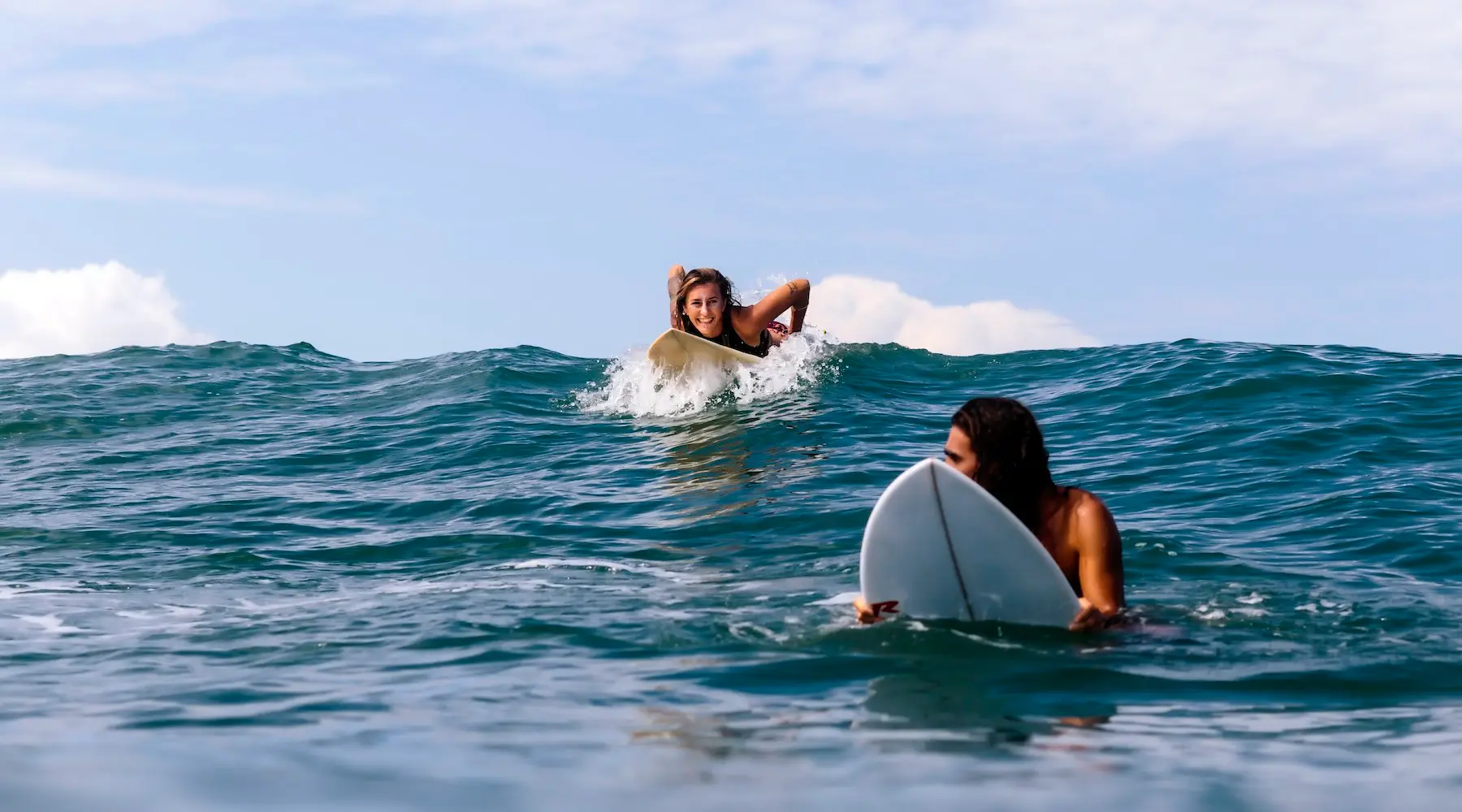 Friends surfing in Bali.