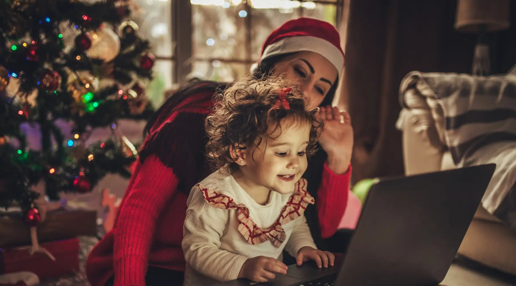 Mother and Daughter on the laptop together at Christmas 