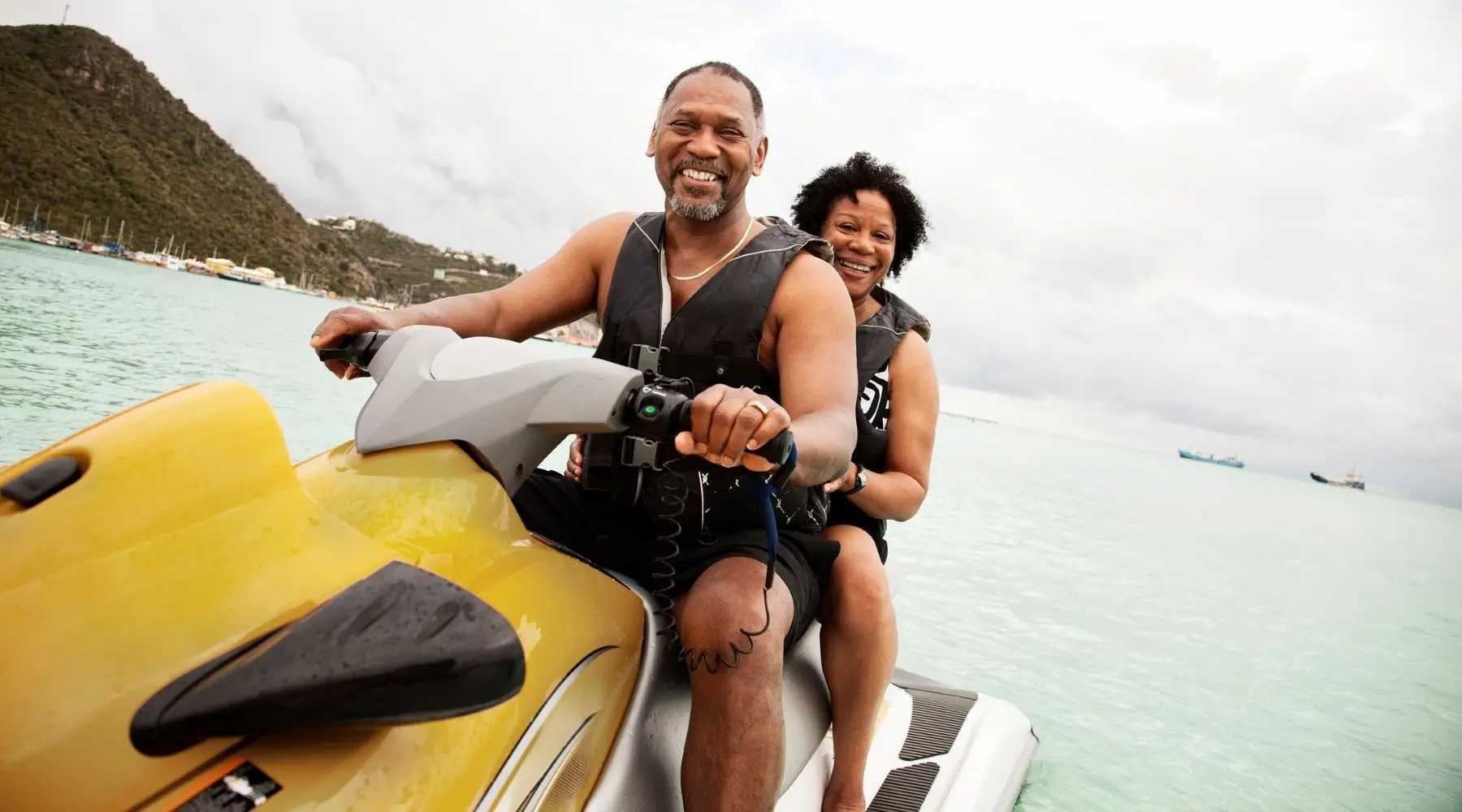 A couple on a jetski, enjoying retirement 