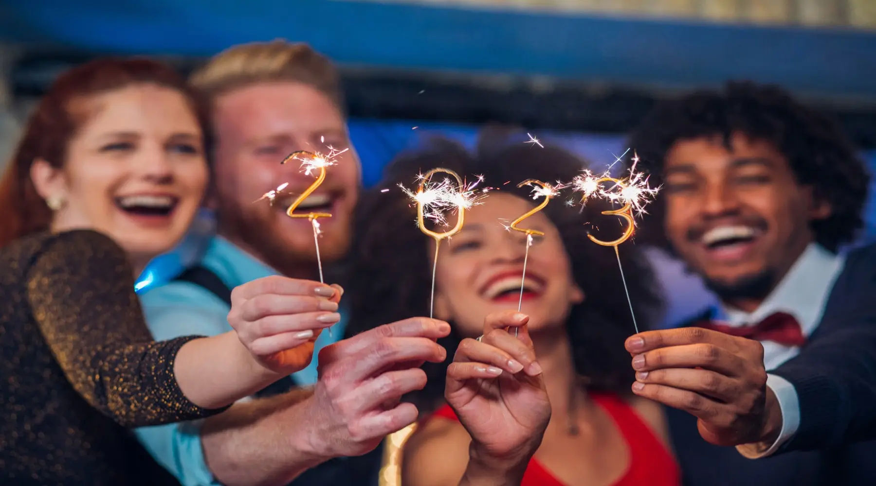 People with sparklers_GettyImages_1800x1000