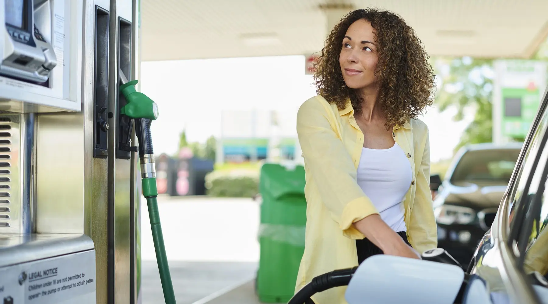 Woman filling car with petrol 