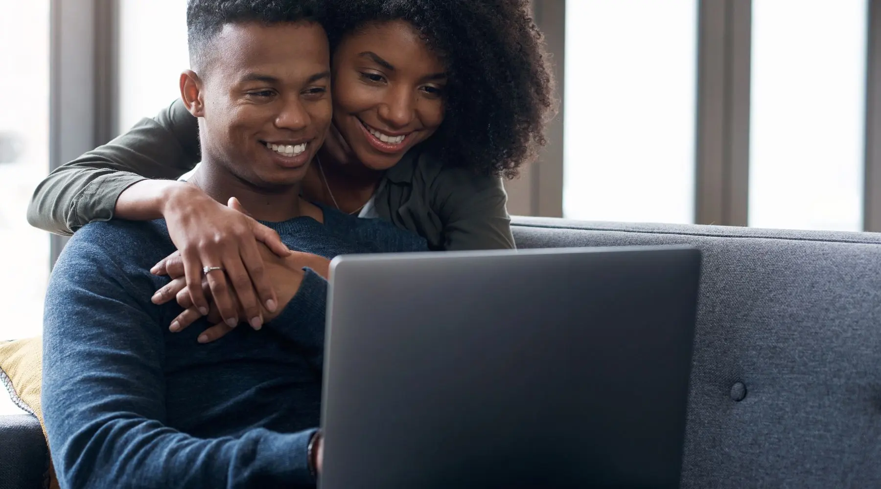 couple looking at a laptop screen