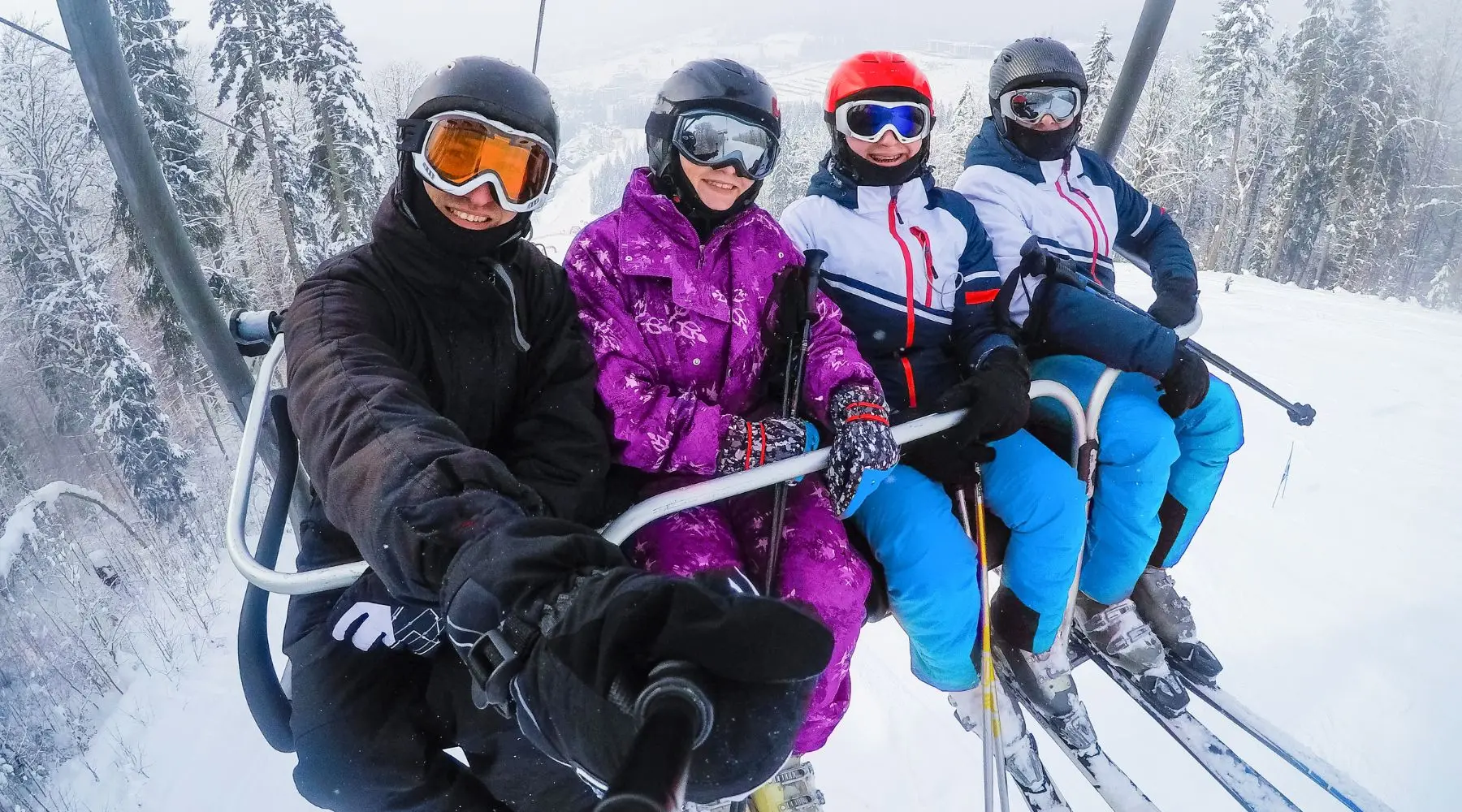 friends on ski lift