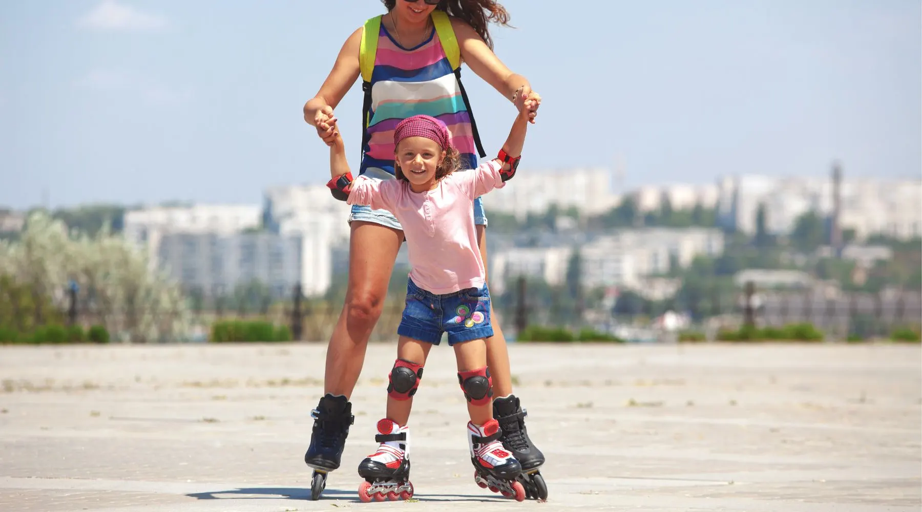 Mother and daughter rollerblading