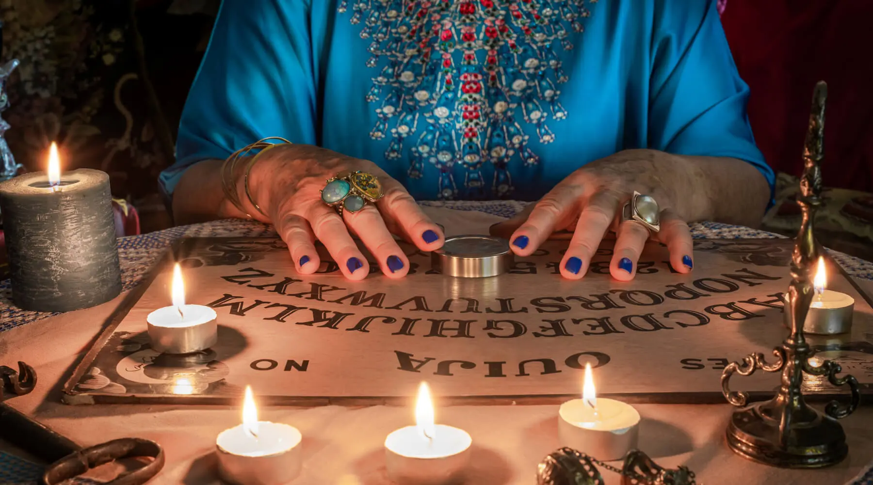 Lady using ouija board