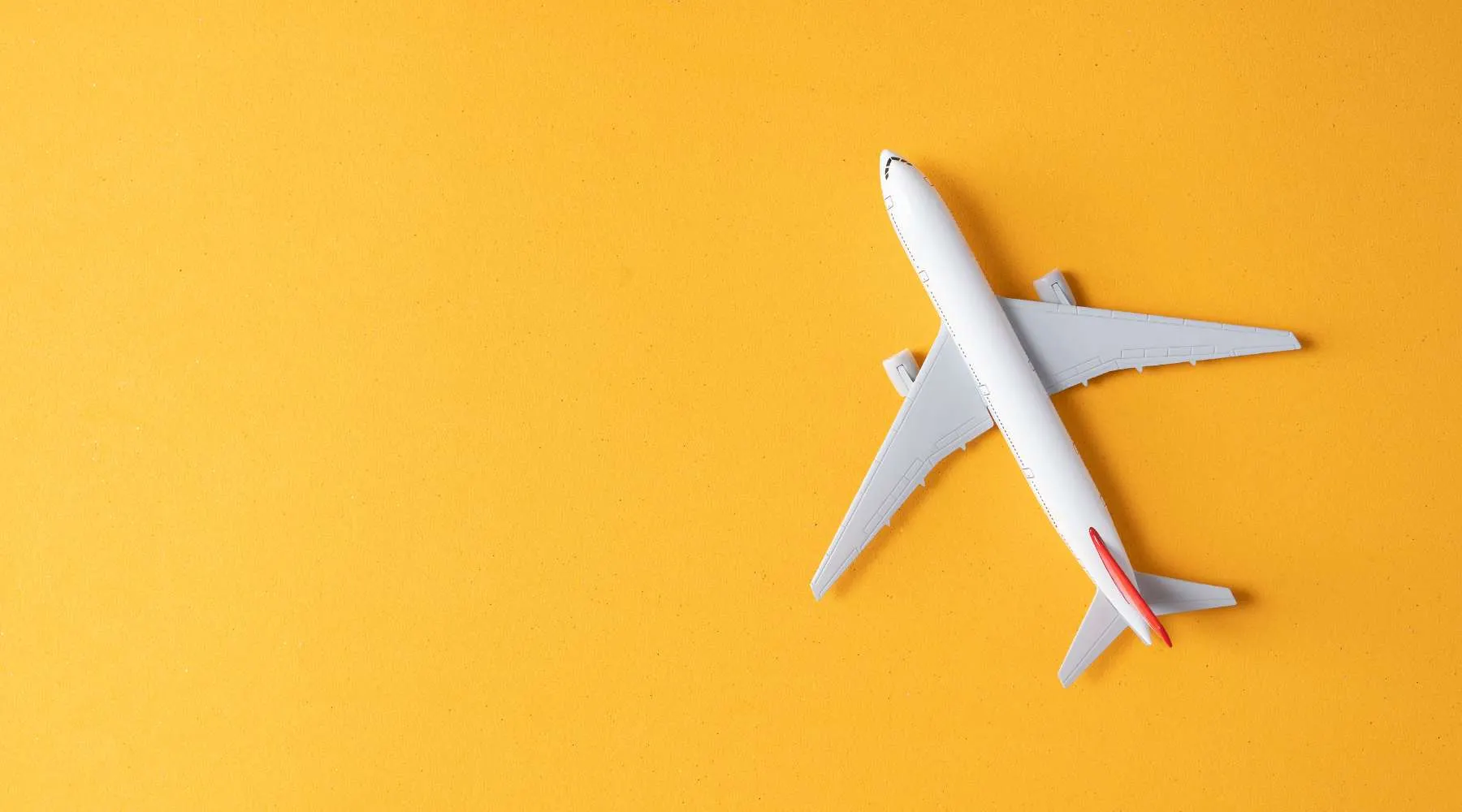 Model airplane on a yellow background