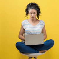 Woman with laptop on knee