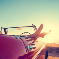 Feet hanging out of a car