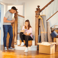 Couple moving in a house